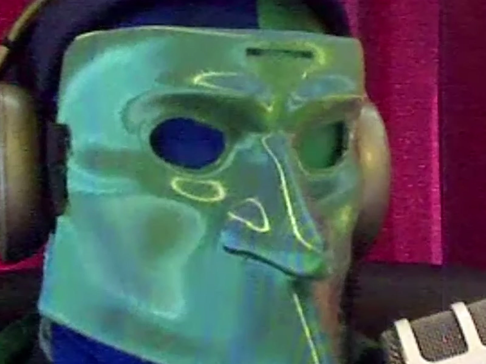 One of the PoliePals, masked, a frame from their own film